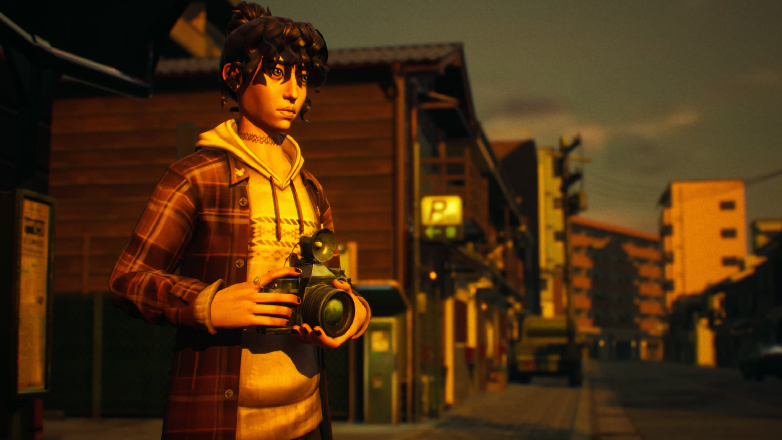 Shiomi holding her camera on a lit street